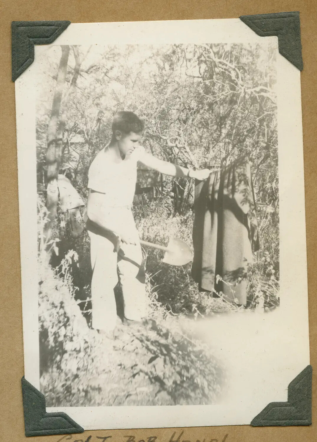 Soldier Airing Blanket at Field Camp, Hawaii, World War II Era