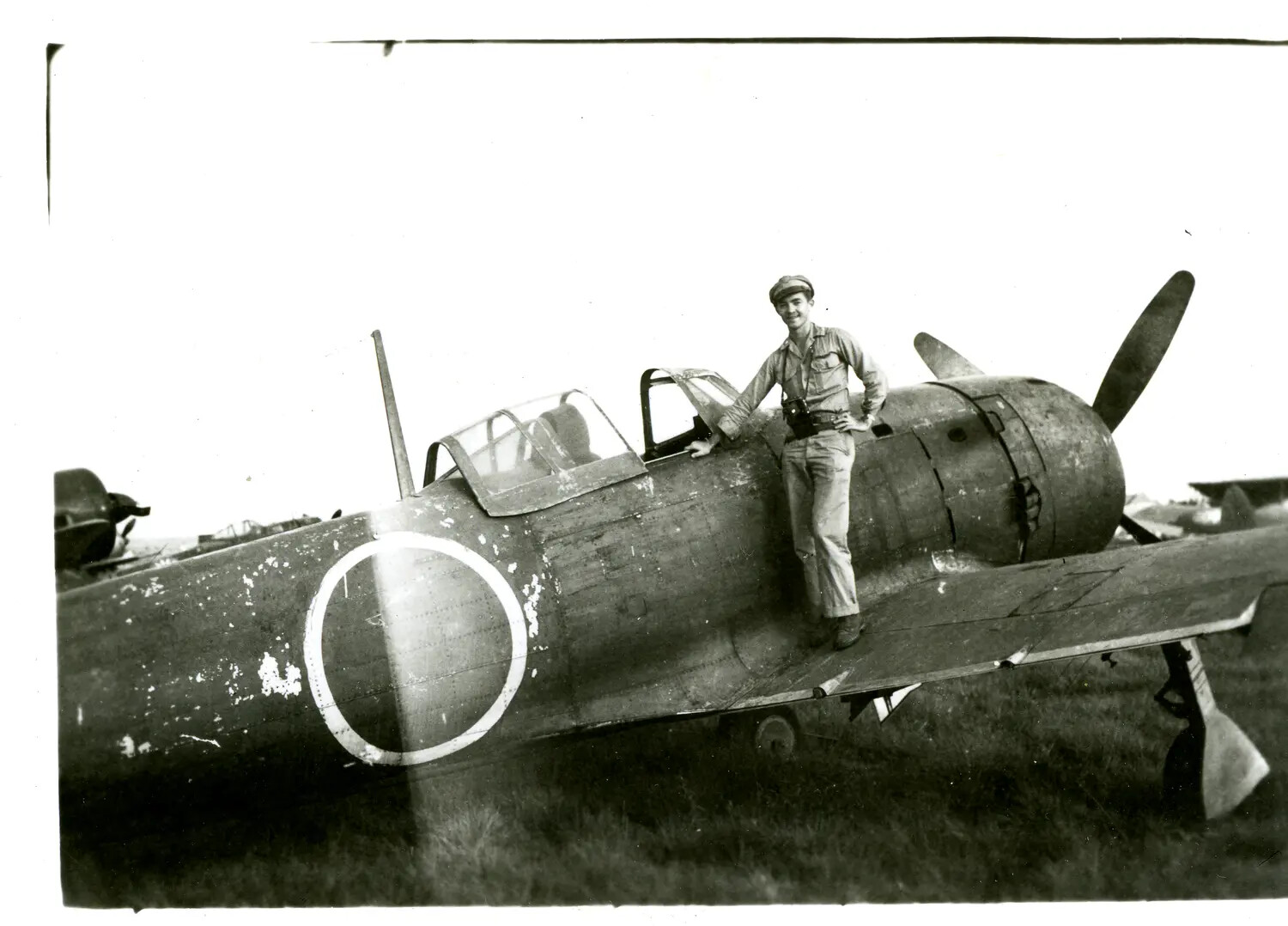 American Serviceman Posing on Captured Japanese Fighter Aircraft, CBI Theater, WWII