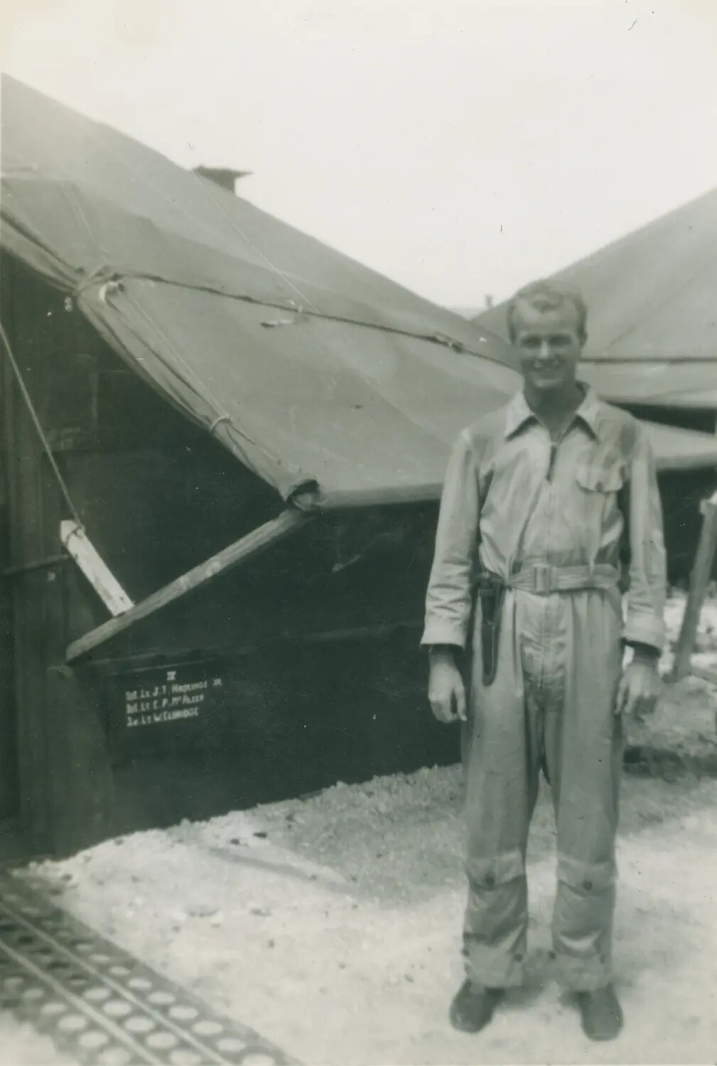 Officer's Tent Quarters Nameboard and Serviceman in Coveralls, Pacific Base, WWII
