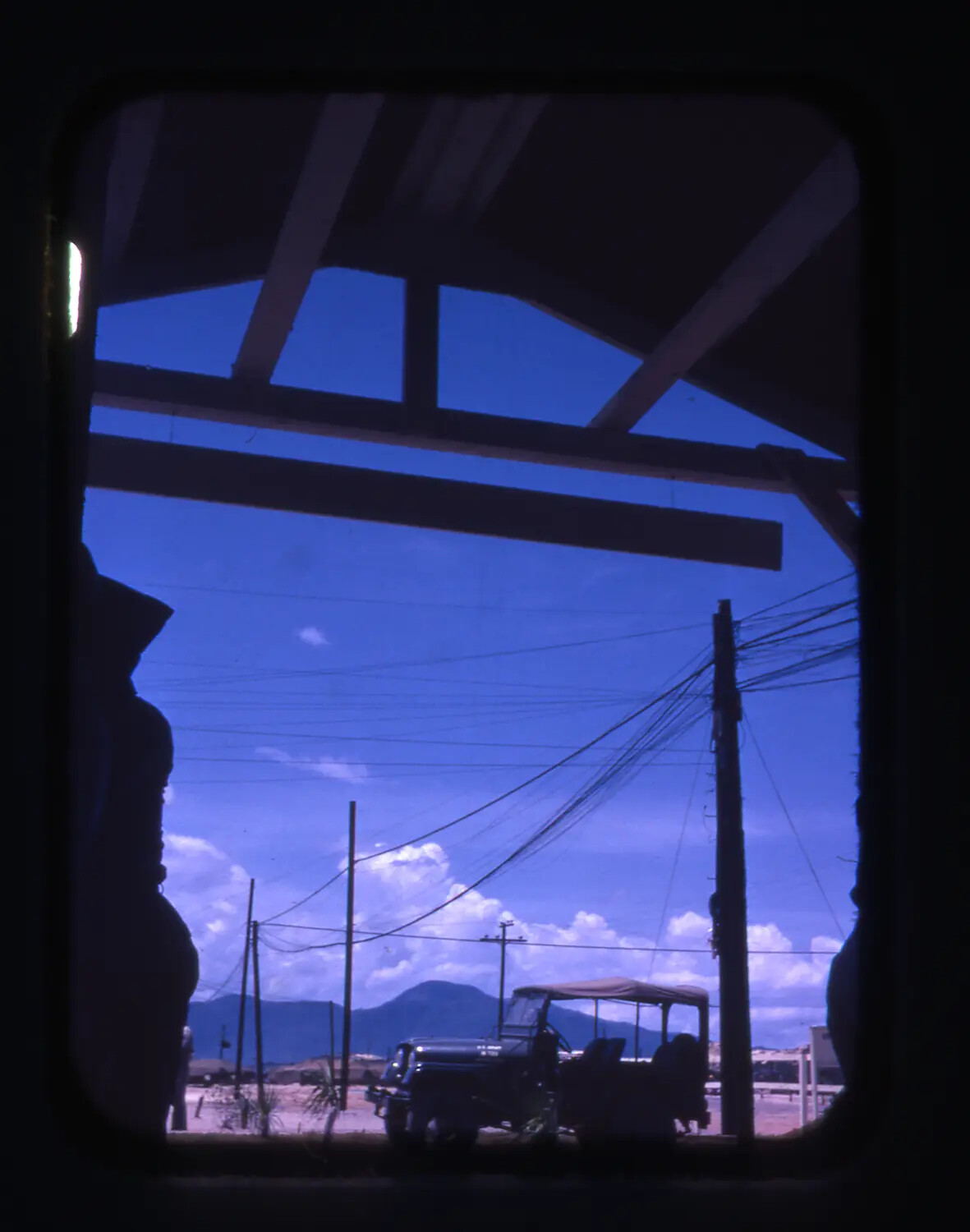 View from Building Shade Toward Parked Jeep and Mountains, Cam Ranh Bay, Vietnam