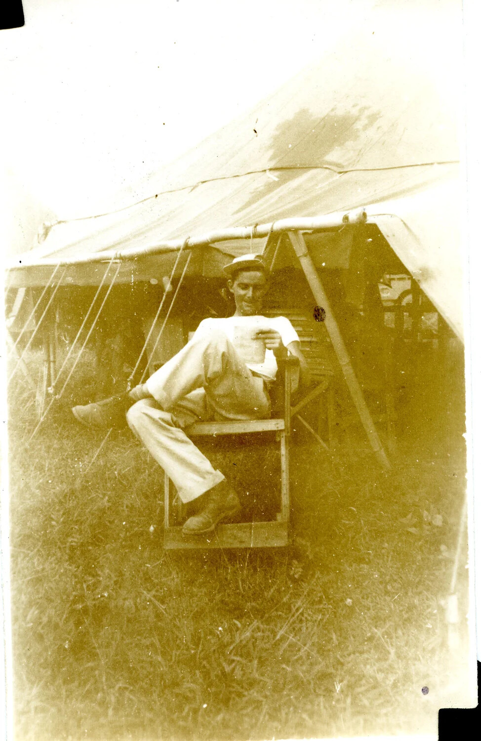 Serviceman Seated Outside Tent, 345th Bomber Group, Ie Shima, WWII