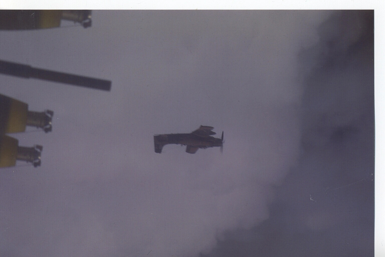 A-1 Skyraider in Flight with Wing-Mounted Ordnance in Foreground