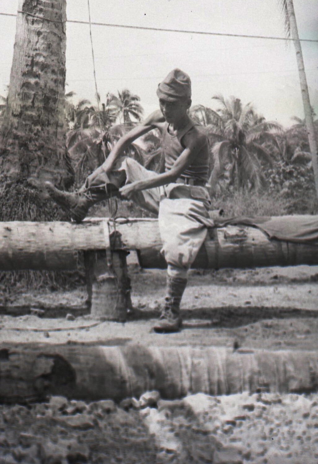 Soldier Washing Laundry at Outdoor Station, Coconut Grove, Luzon, Philippines, WWII