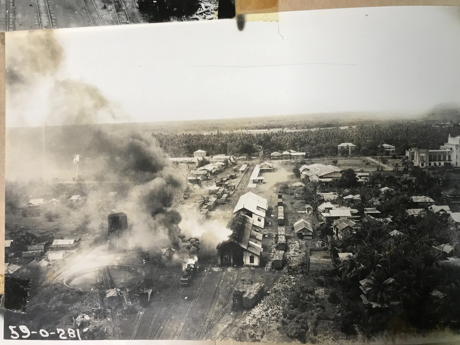 Railway Yard Fire and Turntable Under Attack, Philippines - 312th Bomb Group Strike Photograph (Album Print)