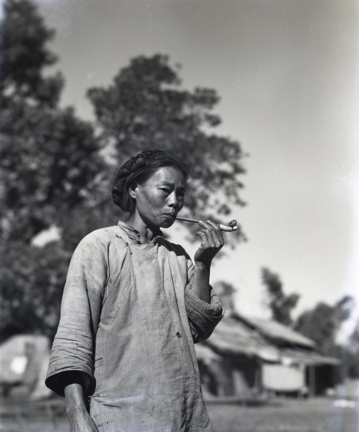 Portrait of a Local Woman Smoking a Pipe, China-Burma-India Theater (Kotec Collection, "Natives" Negatives)