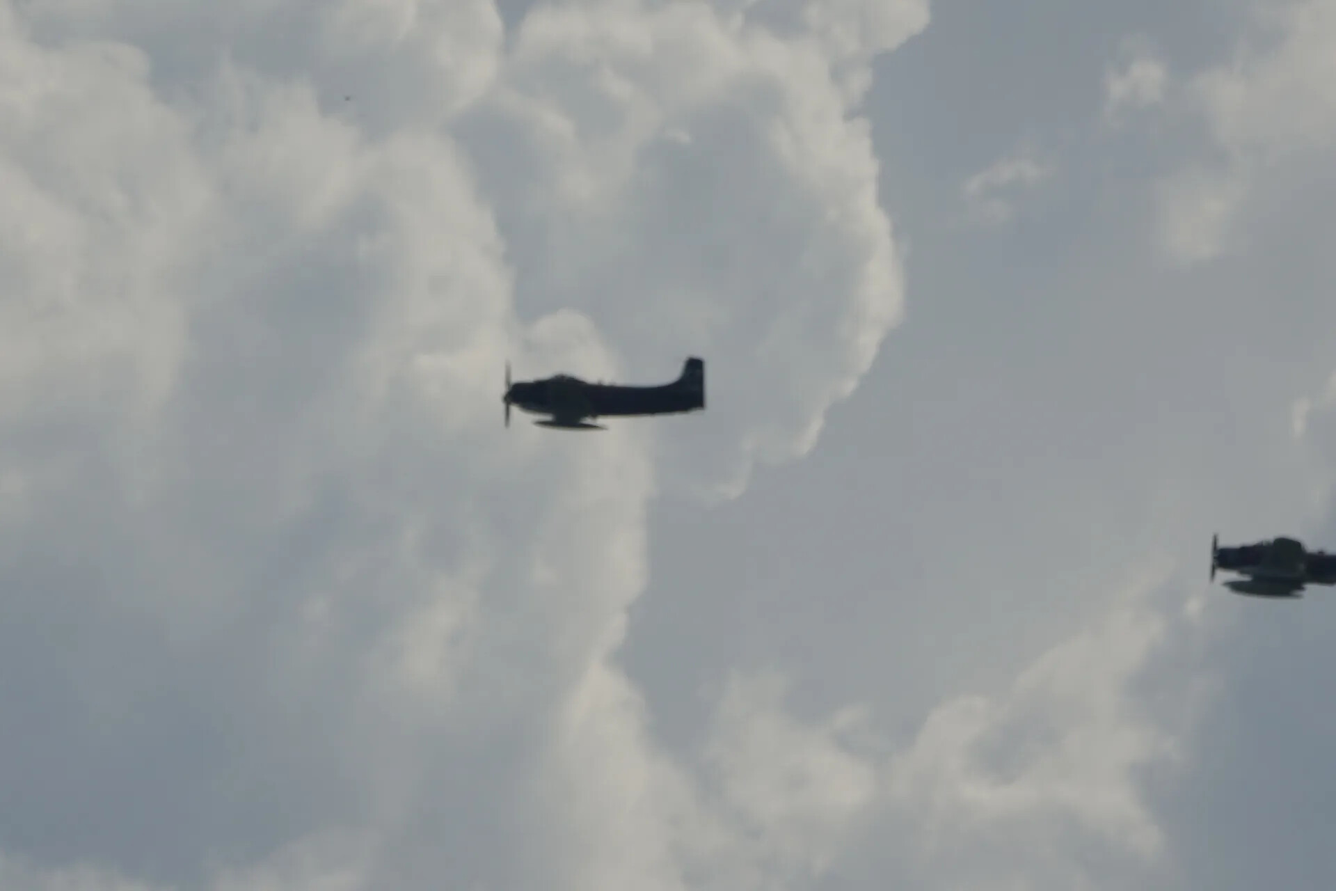 Silhouetted A-1 Skyraiders in Flight, May 2019 Memorial Flyover