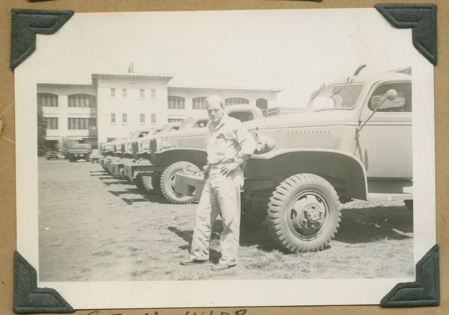 Sgt. Minkler Beside Army Cargo Trucks, Hawaii, WWII