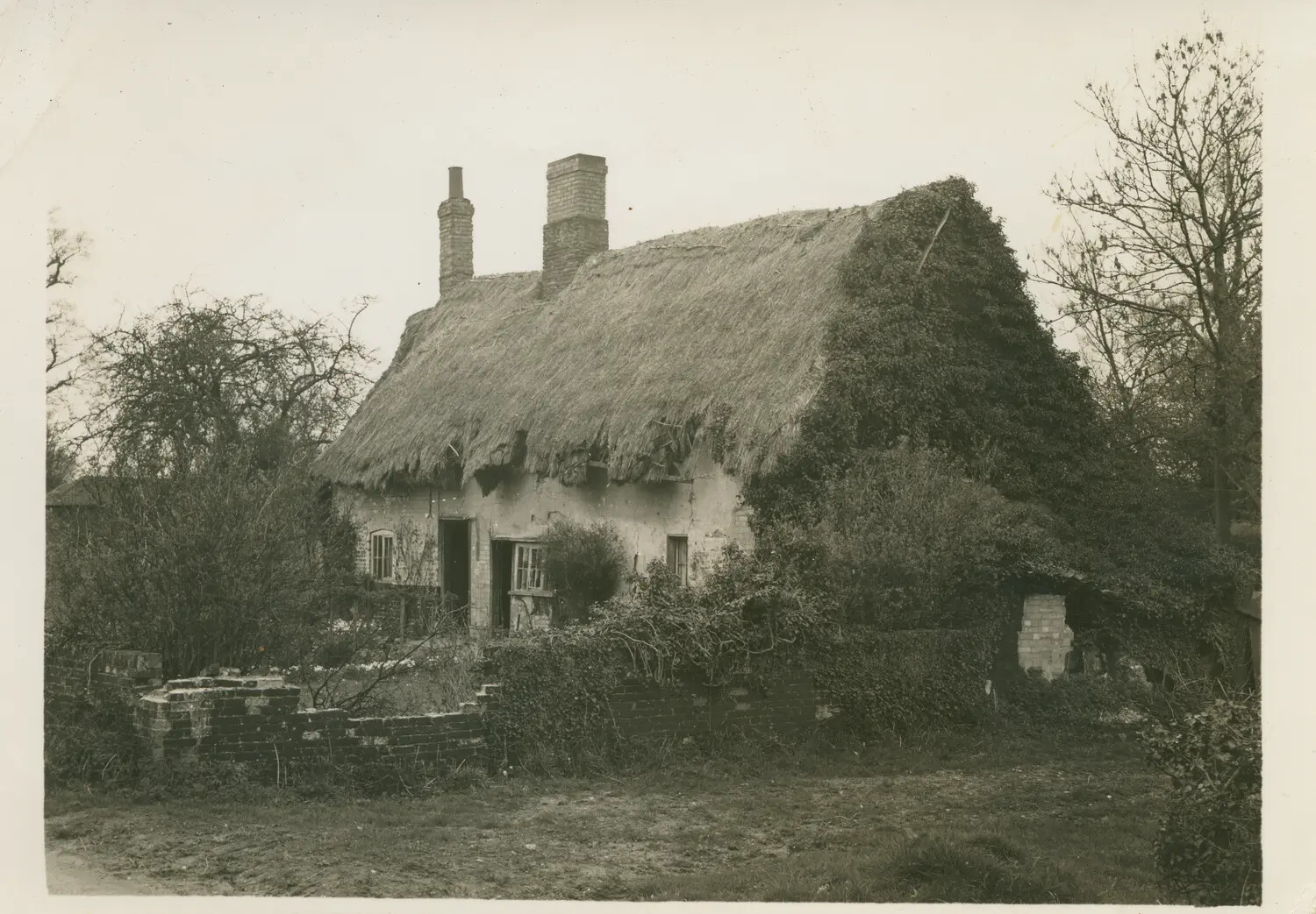 Old English Thatched-Roof Cottage, Norfolk Countryside, England, WWII Era