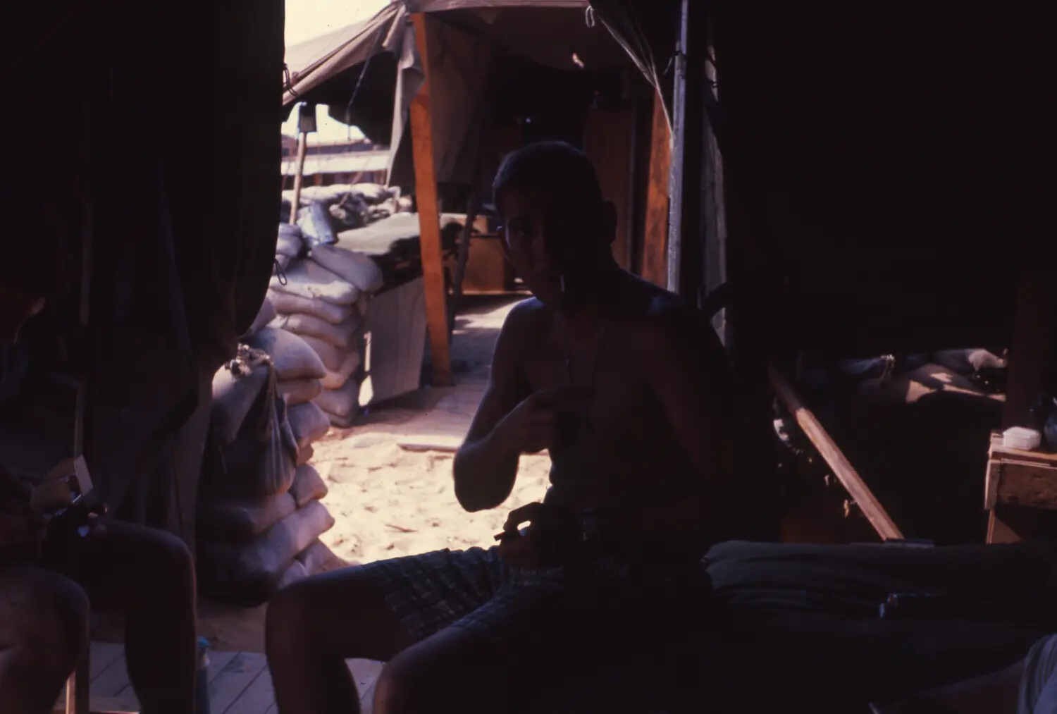 Serviceman in Sandbagged Hooch Interior, Cam Ranh Bay, Vietnam War Era