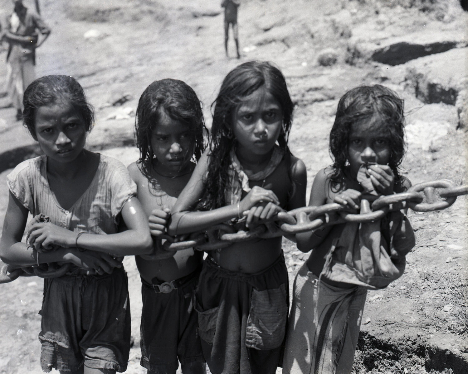 Local Children Holding a Large Chain at a Riverside Site, WWII China-Burma-India Theater Collection