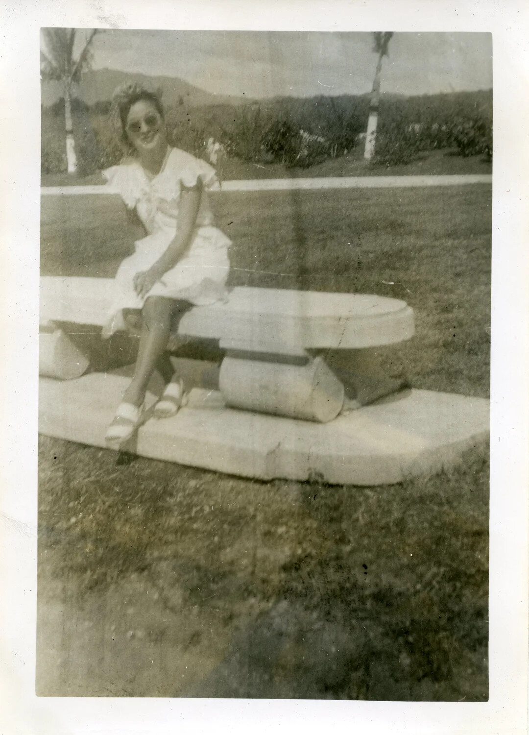 Young Woman on Park Bench, Manila — VR-6 Naval Air Transport Squadron Album, Guam/Philippines