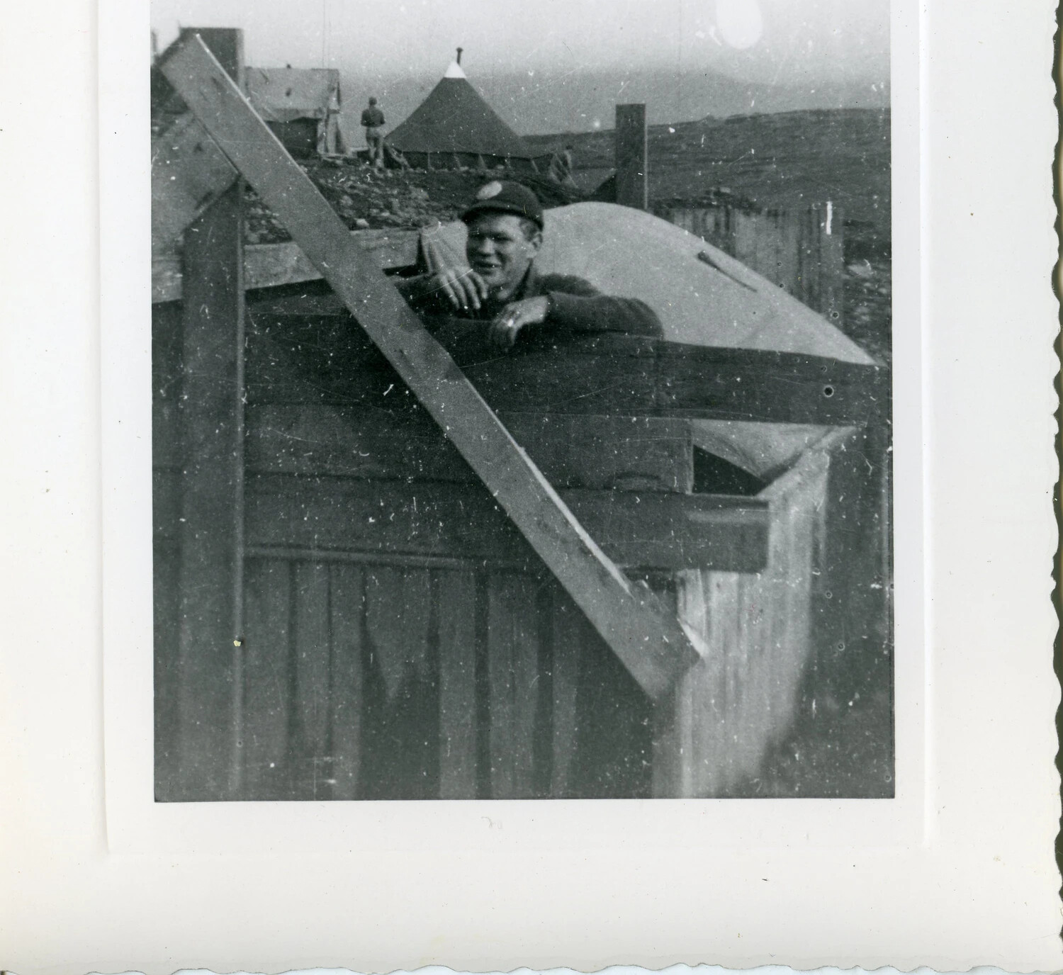 Serviceman at Shelter Doorway with Camp Tents in Background, Aleutian Islands, World War II