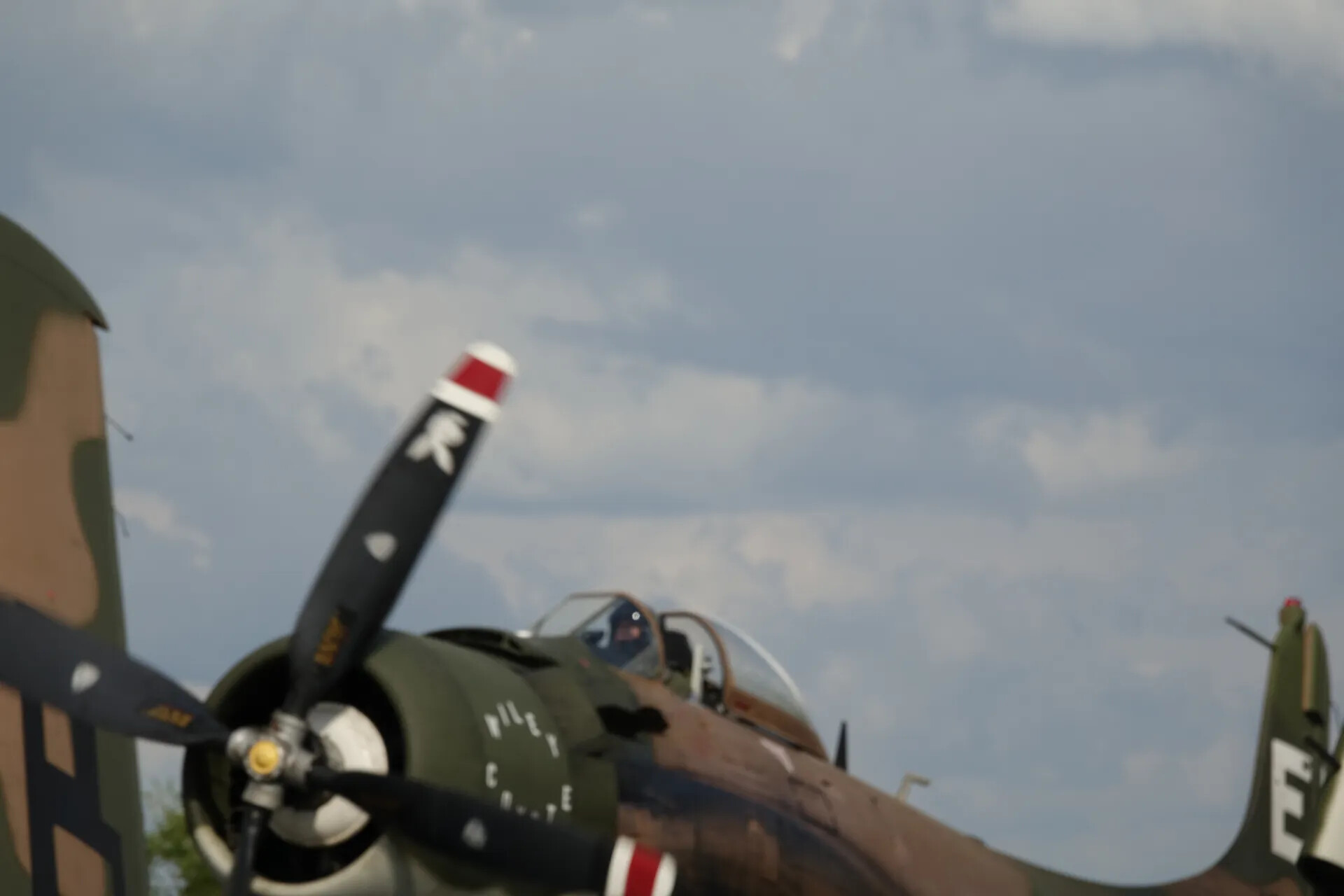 Close-Up of Camouflaged Radial-Engine Warbird Cockpit and Propeller at Flying Event, May 2019