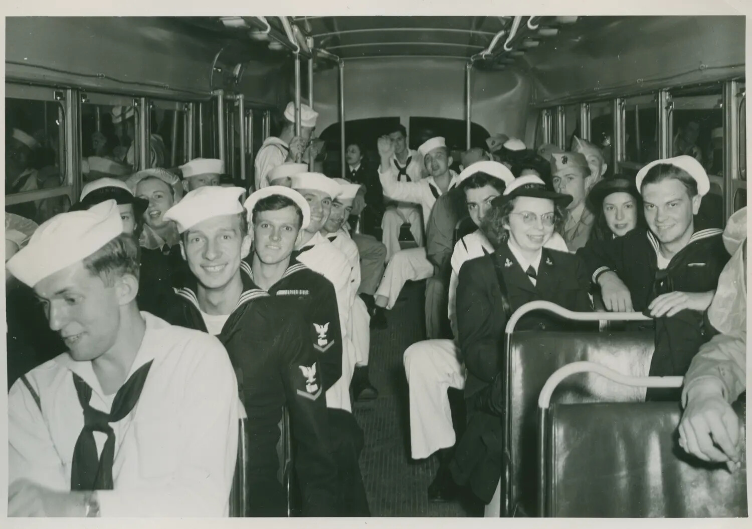 U.S. Navy Sailors and Servicewomen Aboard a Crowded Liberty Bus, WWII Era