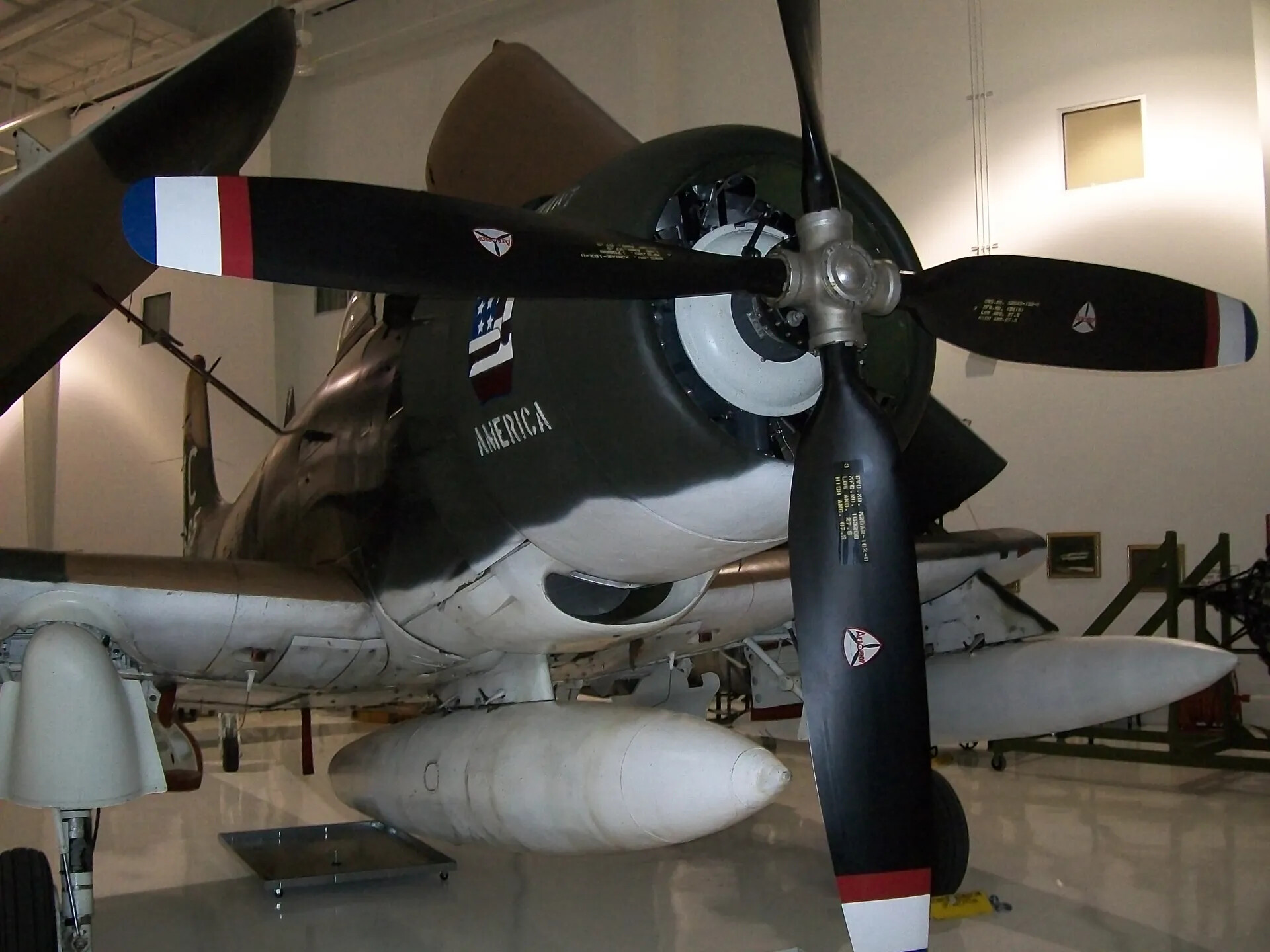 Close-Up of A-1 Skyraider 'AMERICA' Engine, Propeller, and Underwing Stores, Museum Display