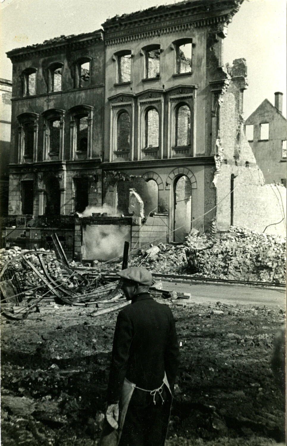 German Civilian Surveying Bomb-Gutted Building Ruins, WWII Aftermath
