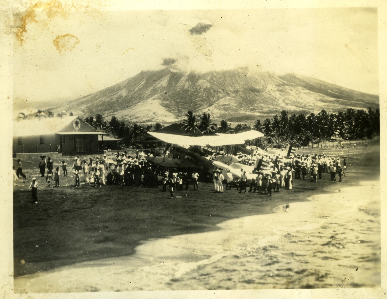 Biplane Beached Near an Active Volcano with Gathered Crowd, Philippines, Early-Mid 20th Century