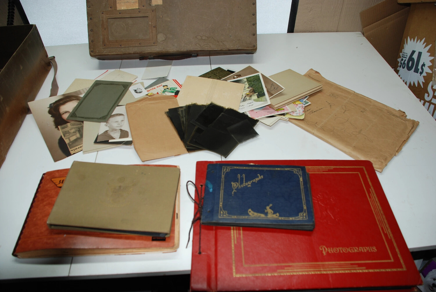 Jack T. Kelley Collection: Loose Photographs, Negatives, and Ephemera Laid Out for Cataloguing
