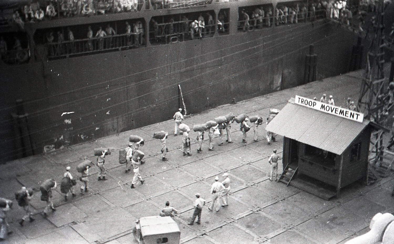 Soldiers Filing Toward Troopship at "Troop Movement" Control Point, Philippines, World War II