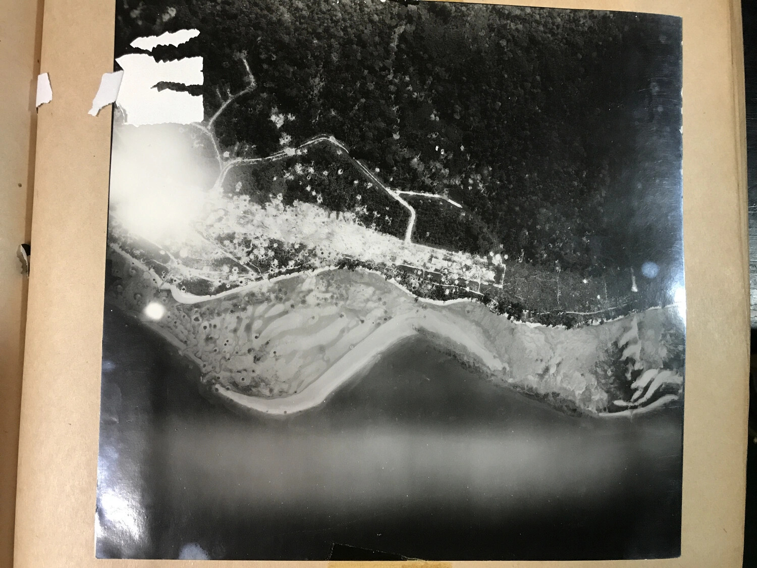 Low-Level Aerial Reconnaissance Photograph of a Pacific Coastline and River Mouth, 312th Bomb Group