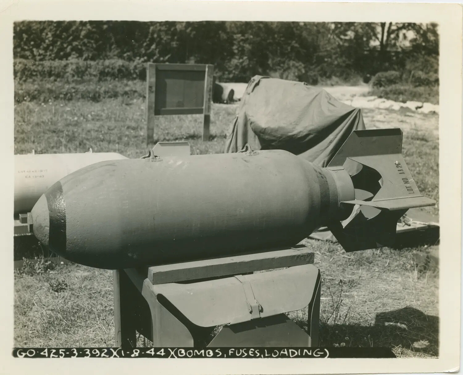 WWII Ordnance Photograph, Aerial Bomb on Loading Cradle with Fuse and Arming Vane, England, 1944
