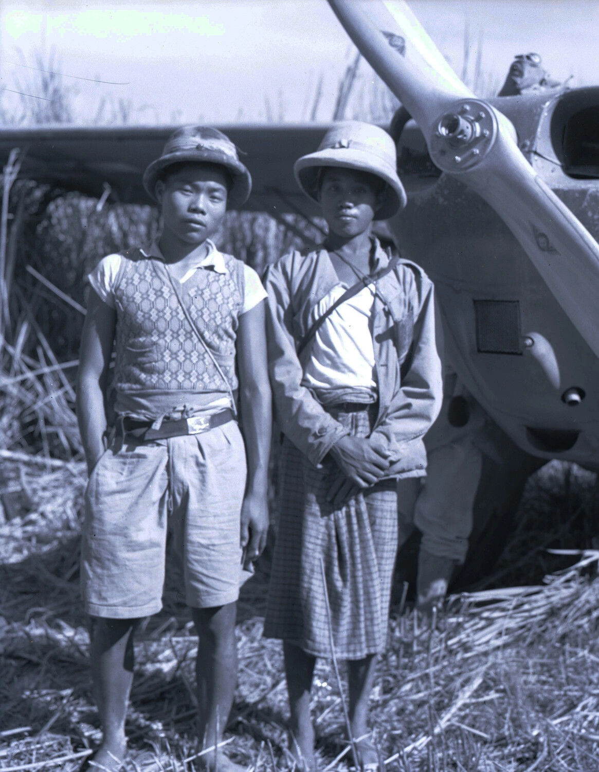 Local Guides Beside a Stinson L-5 Sentinel Liaison Aircraft, China-Burma-India Theater, WWII