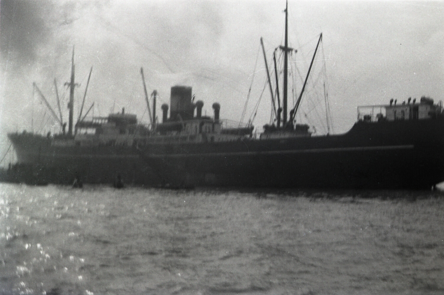 Cargo Steamship at Anchor in Silhouette, Chinese Harbor