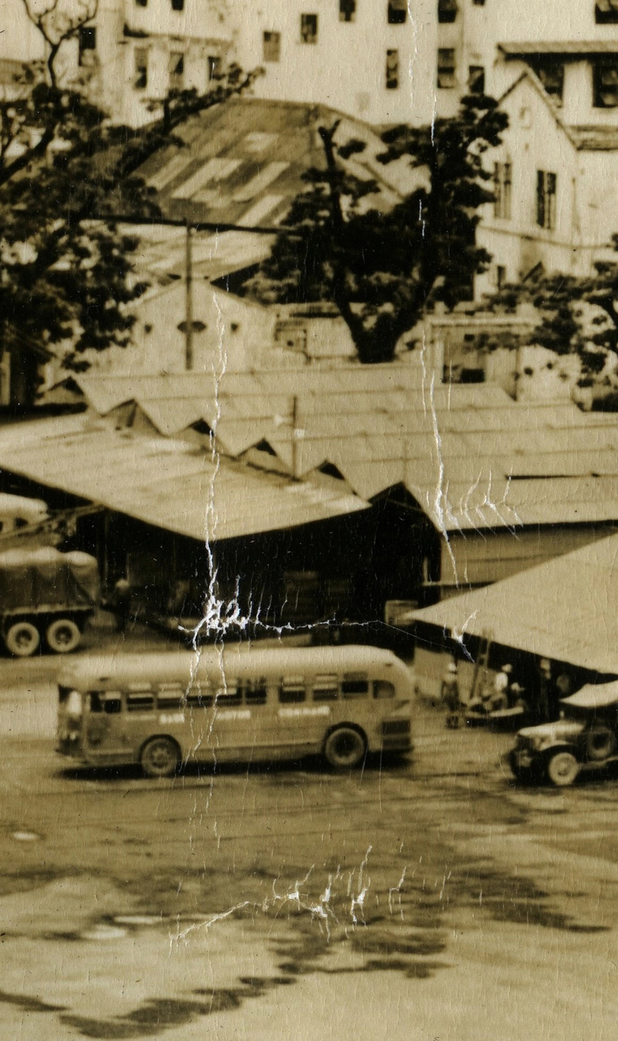 Detail View: Passenger Bus and Shed Row, Battery 'C' Encampment, Manila, Philippines, 1946