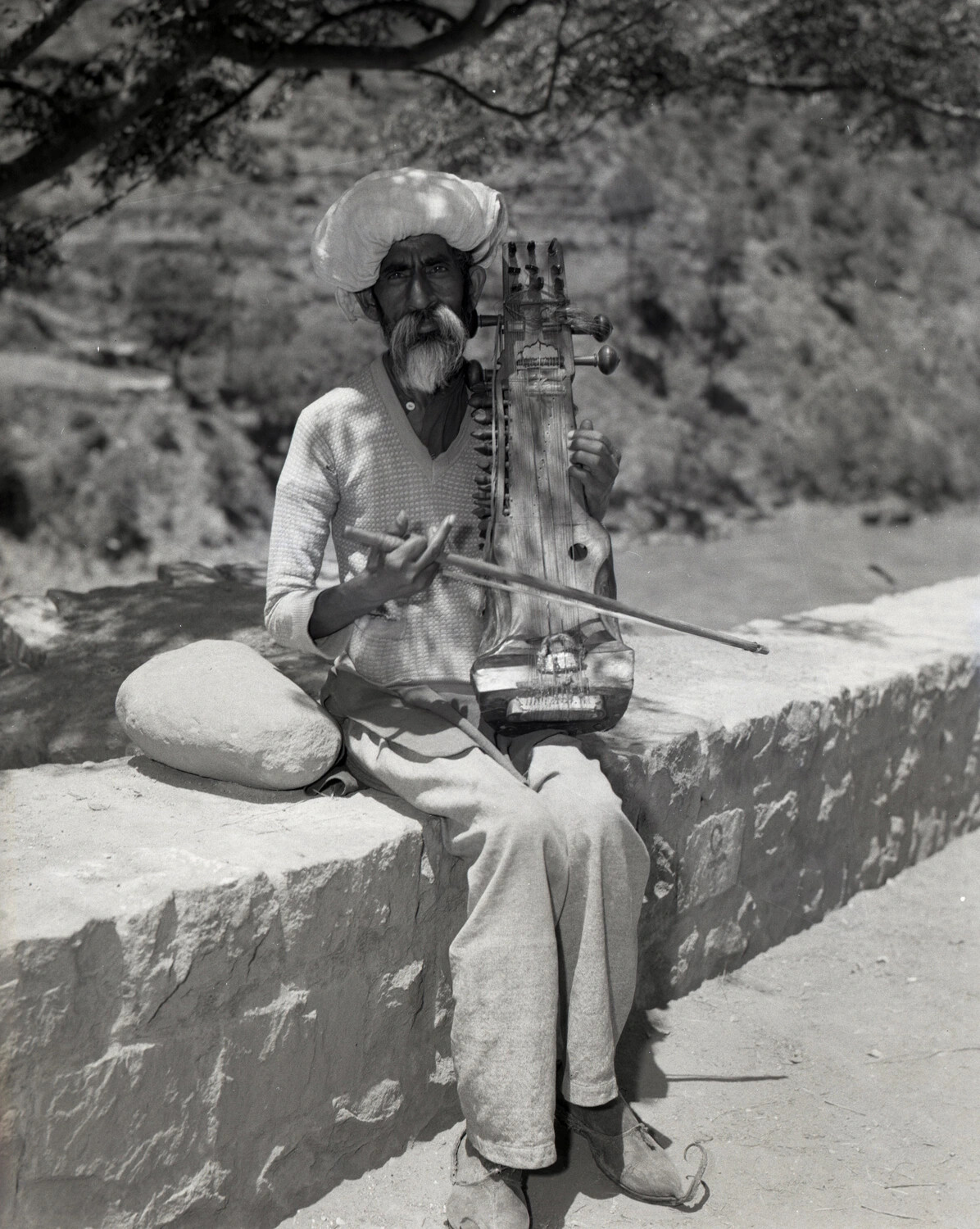 Portrait of a Kashmiri Musician Playing a Sarangi-type Instrument, Kashmir, 1940s