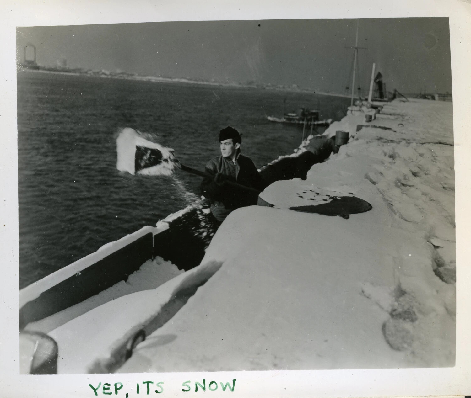 U.S. Navy Sailor Shoveling Snow Aboard USS Franklin D. Roosevelt (CVB-42)