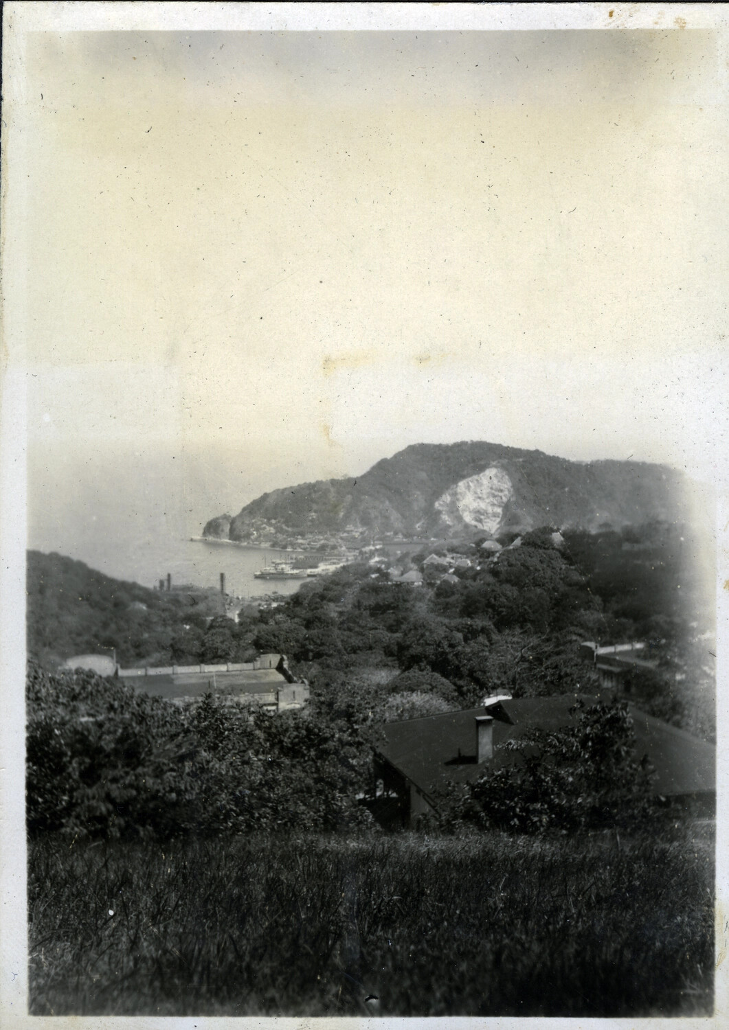 Elevated View of a Harbor Settlement with Ships and Waterfront Buildings, Philippines, Early-Mid 20th Century