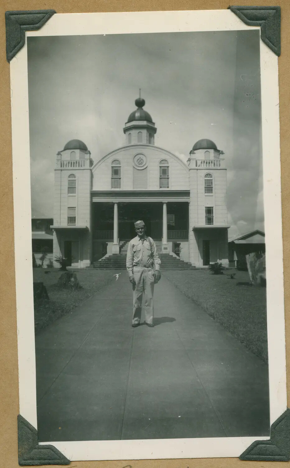 U.S. Serviceman Posing Before a Domed Civic Building, Hawaii, World War II Era