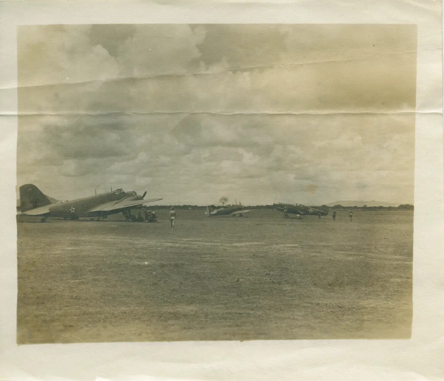 U.S. Military Transport and Fighter Aircraft on Grass Airfield, WWII-Era