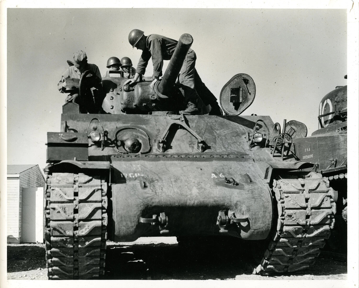 M4 Sherman Tank Crew Atop Turret During Maintenance, 11th Armored Division