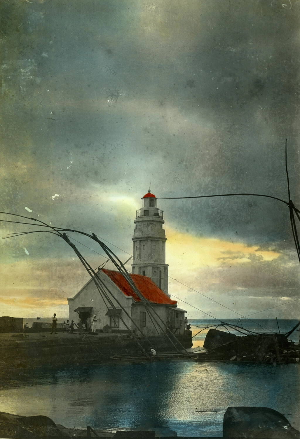 Coastal Lighthouse and Keeper's House at Sunset with Fishing Structures, Philippines, Hand-Tinted Photograph