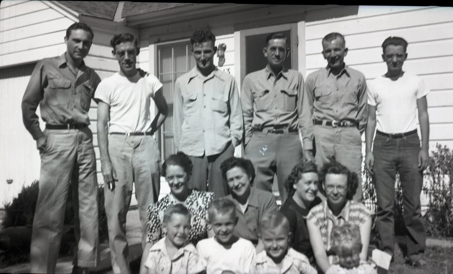Extended Family Group Portrait Outside Farmhouse, Kelley Family Album