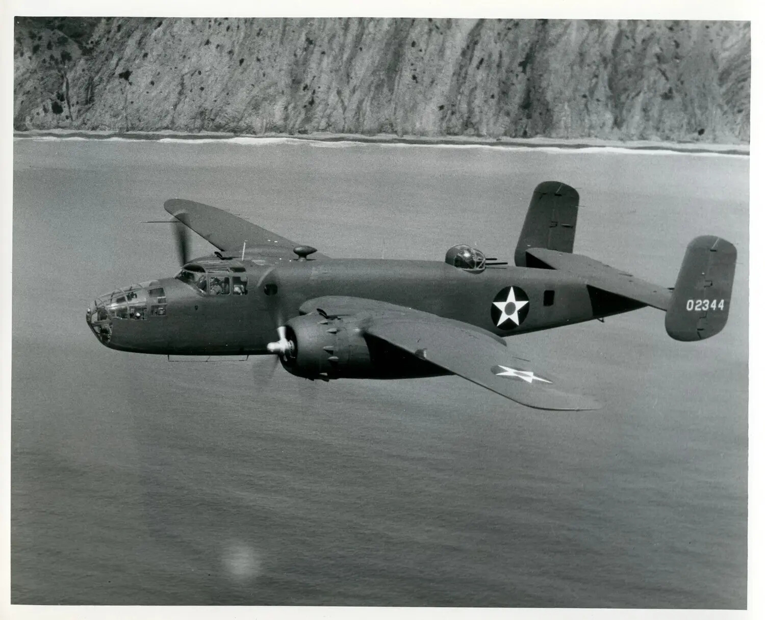 North American B-25 Mitchell Medium Bomber in Flight Along Coastline, WWII Era