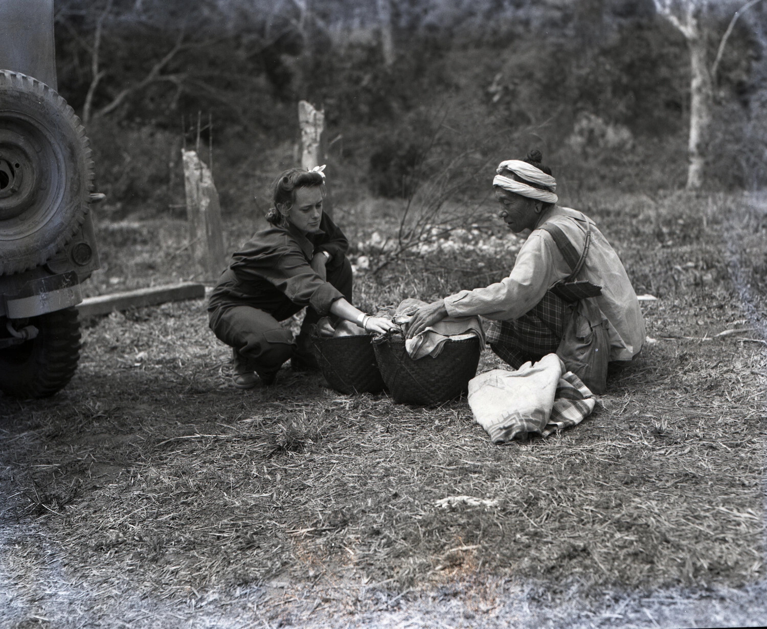 American Servicewoman and Local Villager Sorting Goods, China-Burma-India Theater, WWII