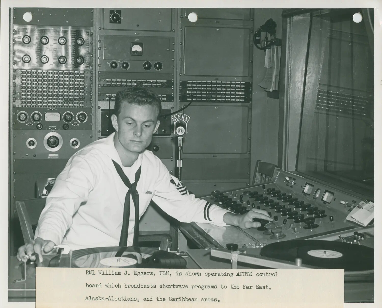 RM1 William J. Eggers Operating AFRTS Shortwave Broadcast Control Board