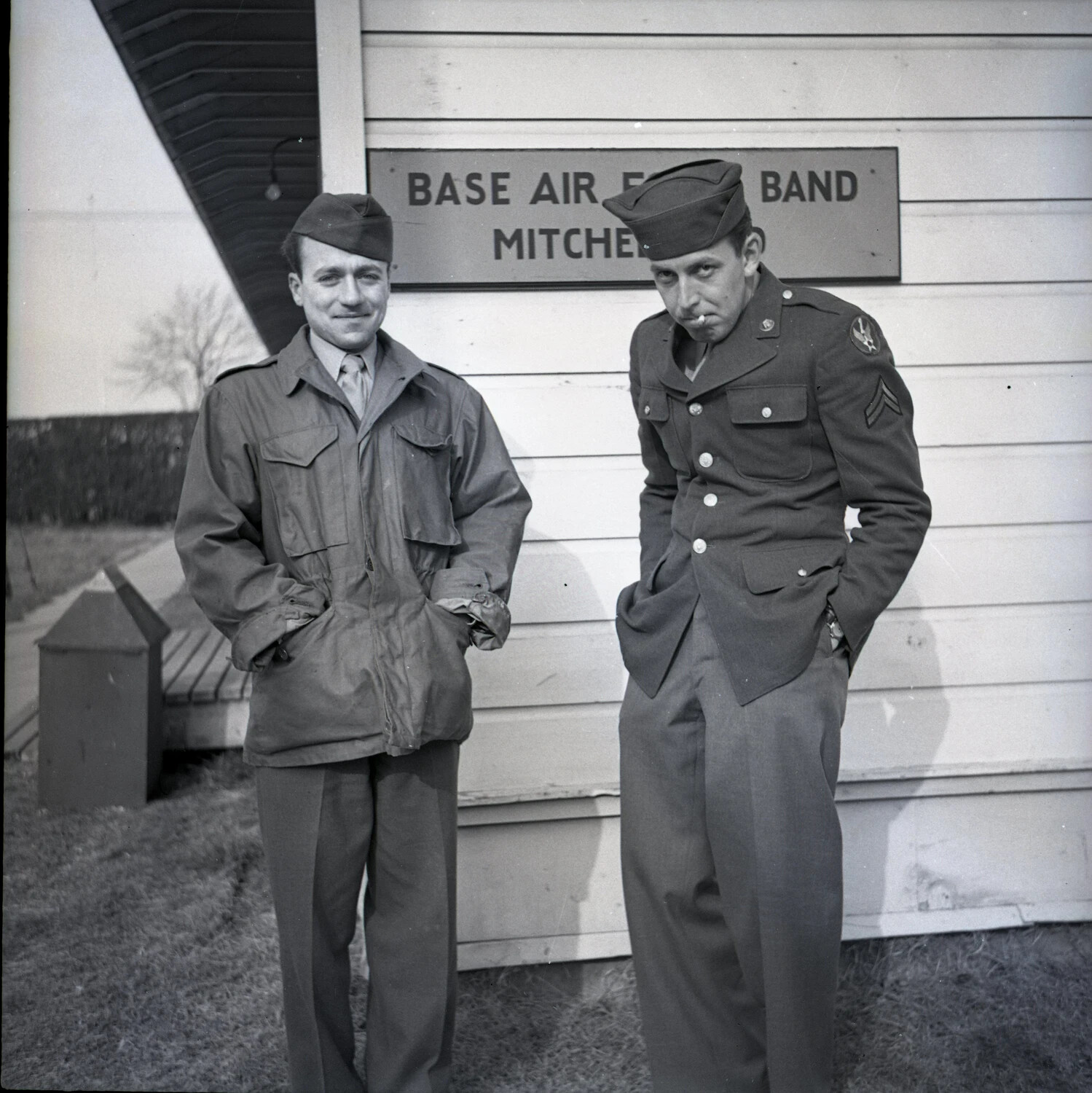 Two Bandsmen Posed Before the Base Air Force Band Sign, Mitchel Field