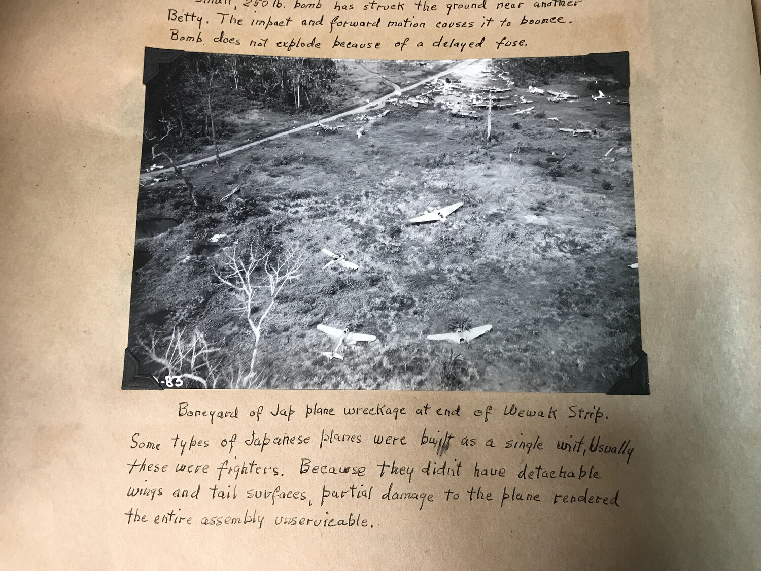 Album Page: 'Boneyard of Jap Plane Wreckage at End of Wewak Strip' with Technical Notes