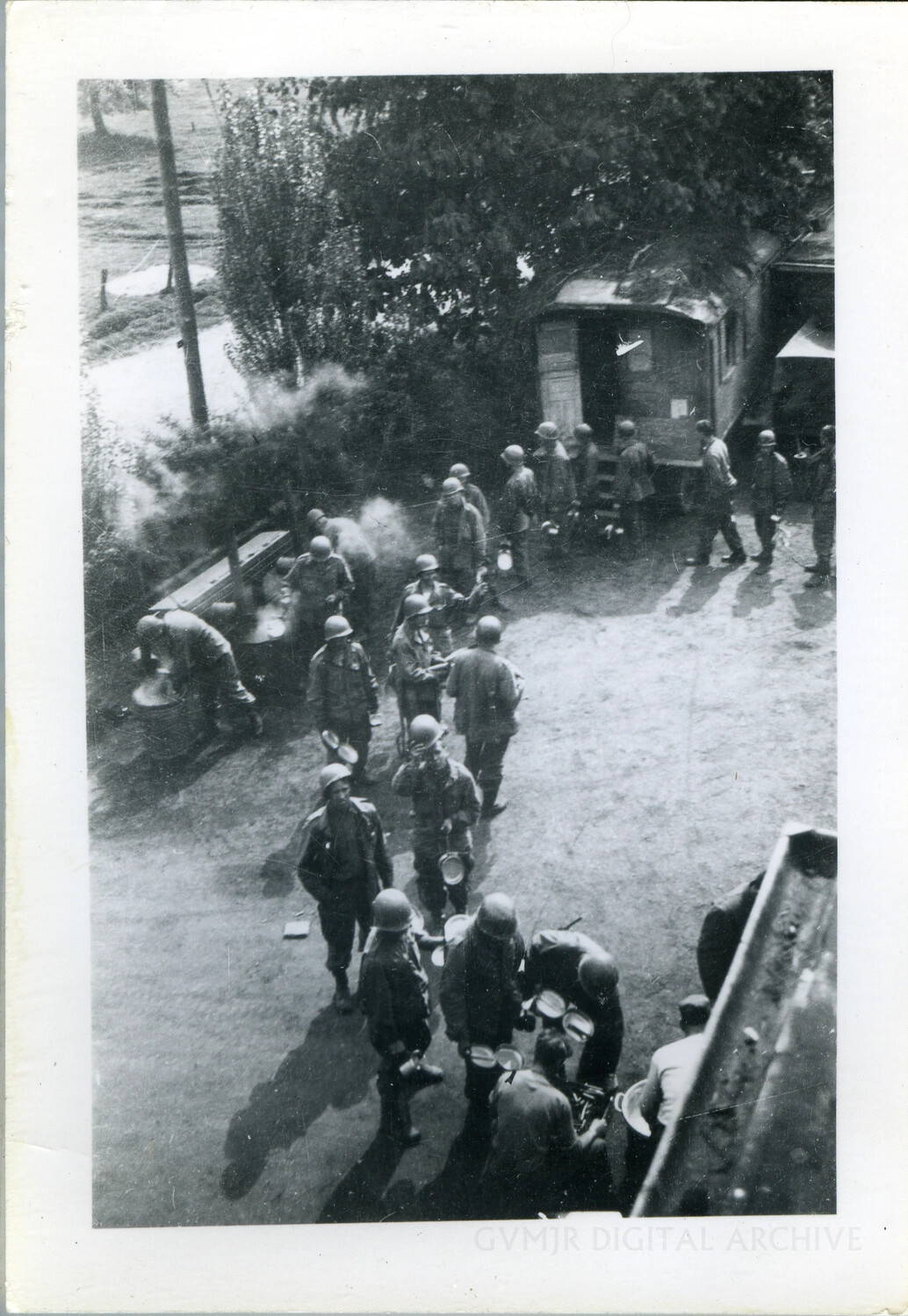 Soldiers Queuing at a Field Kitchen with Mess Kits, Elevated View — European Theater, Summer/Fall 1944