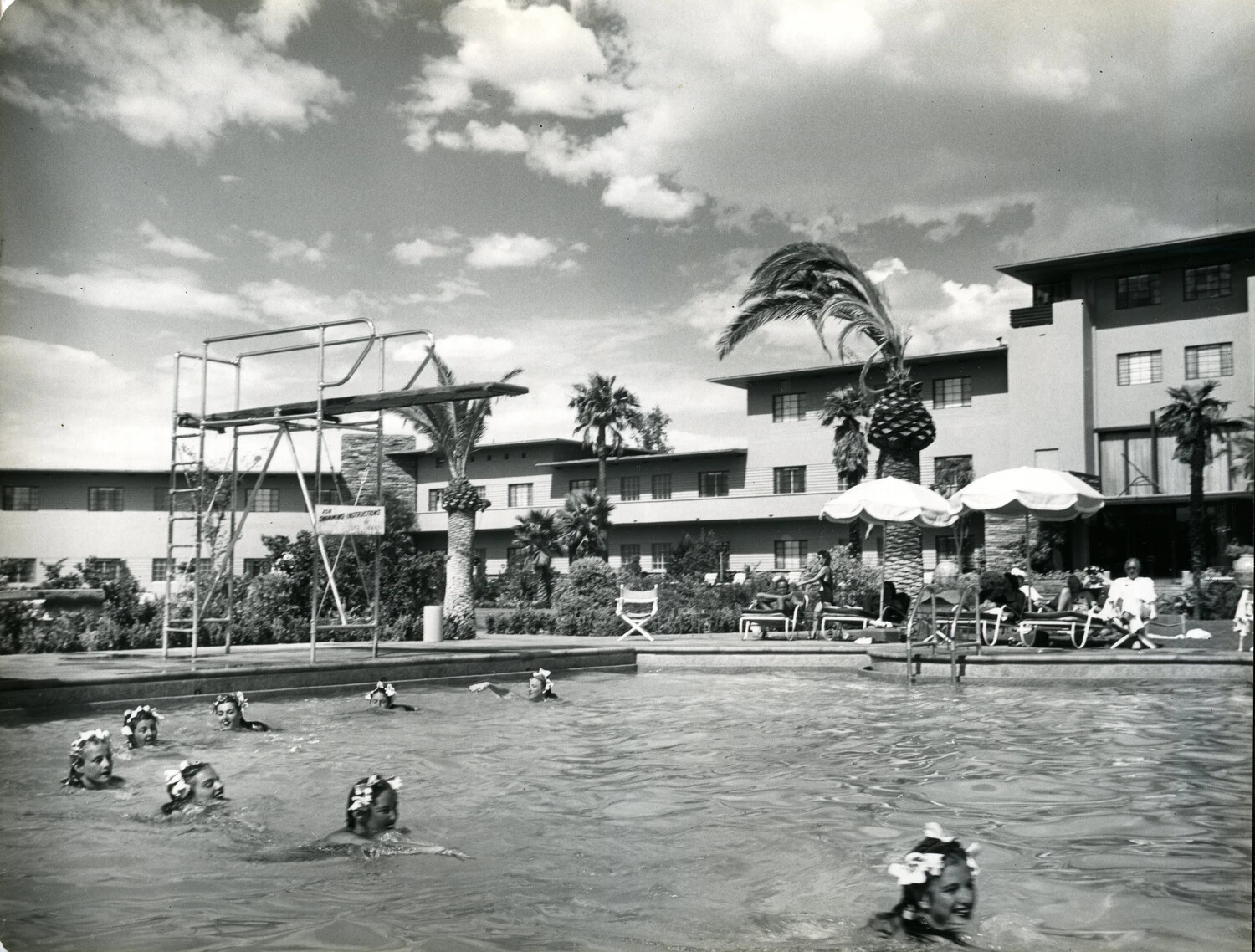 Young Swimmers in Flowered Caps at Resort Pool, c. 1949