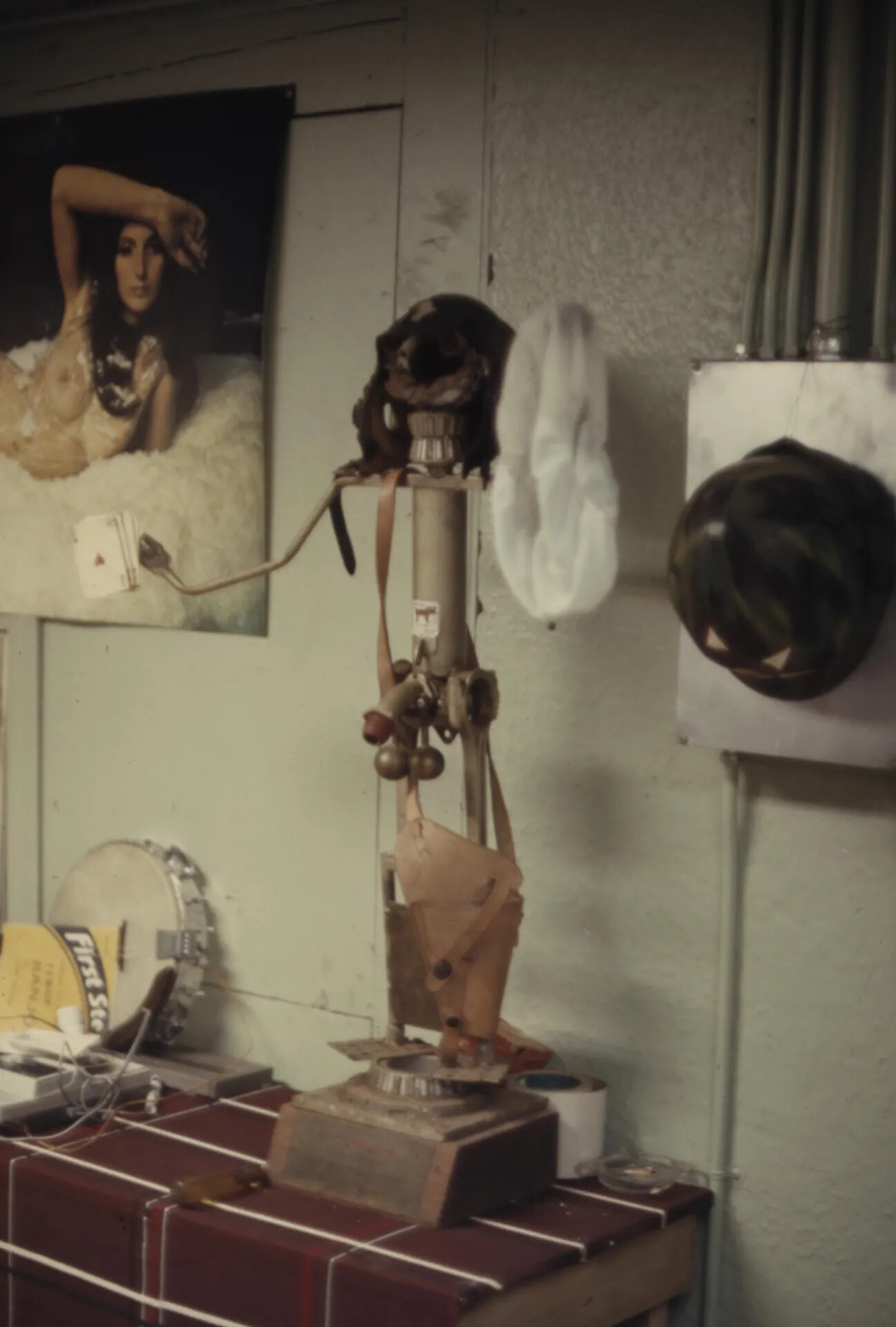 Interior of a Barracks Room or Unit Shop with Pin-Up Poster, Leashed Animal on a Pedestal Stand and Hanging Equipment — Vietnam-Era Colour Slide