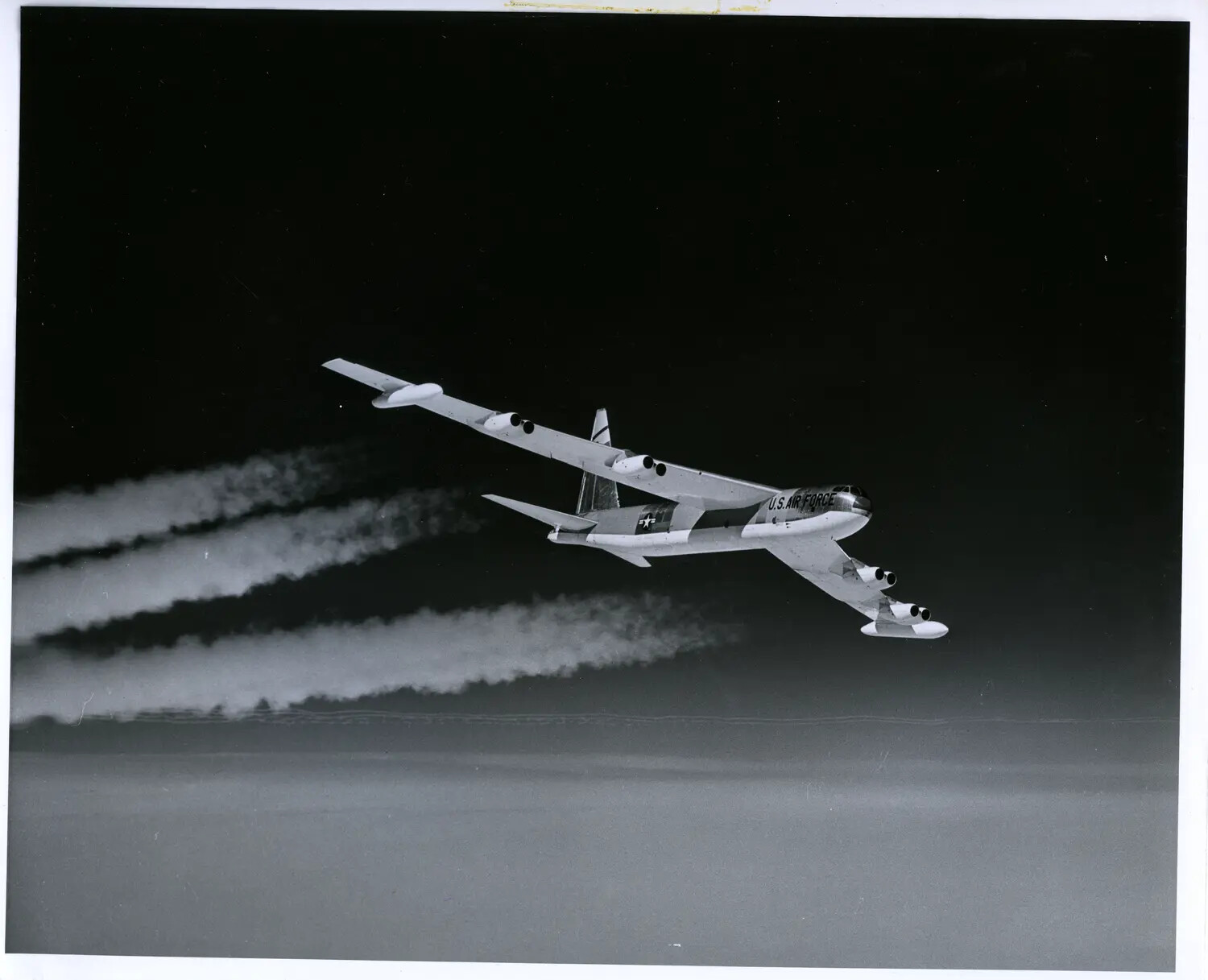 Boeing B-52 Stratofortress in Climbing Turn, Dramatic Night/Low-Light Sky with Contrails