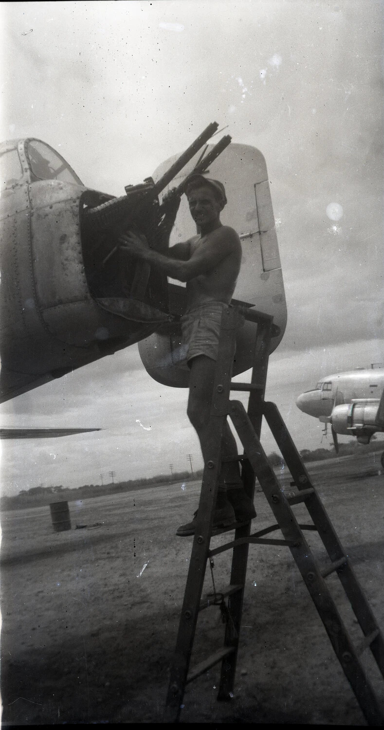 Ground Crewman Servicing B-25 Mitchell Tail Gun Turret, Pacific Theater, WWII