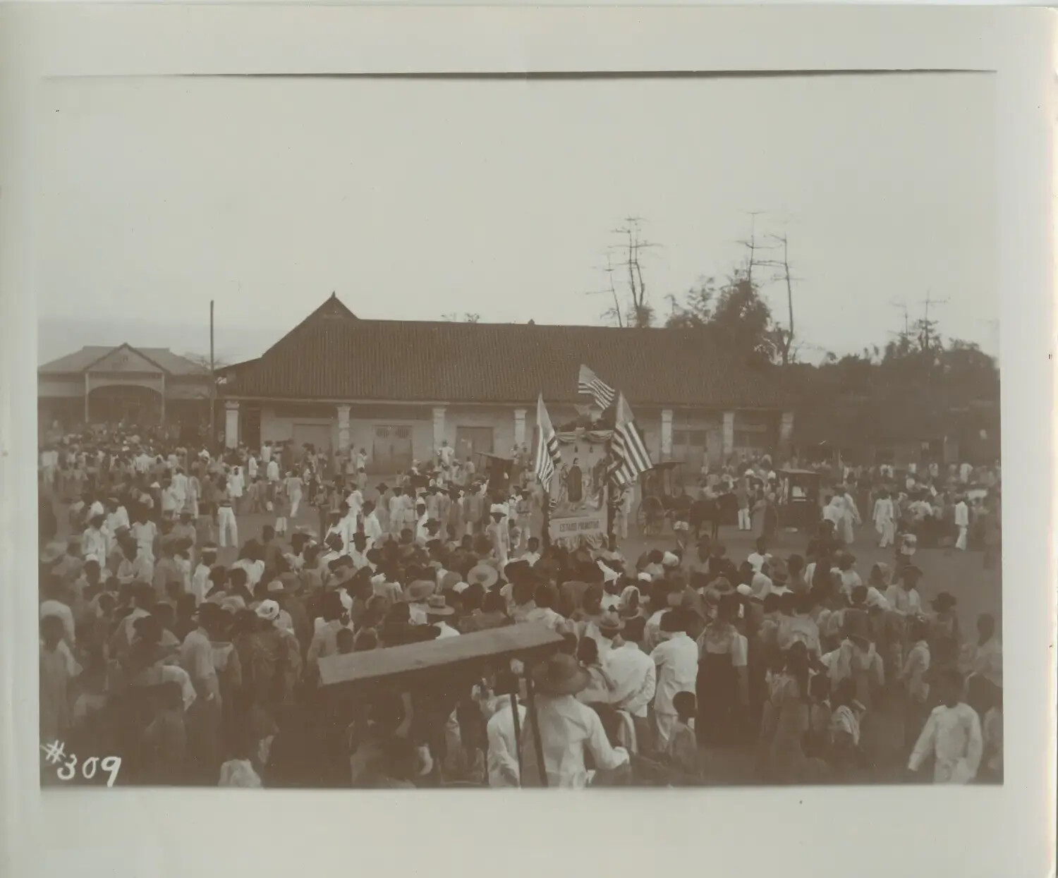 Crowd Gathered for Procession with American Flags, Philippine Town Plaza, c. 1898-1910