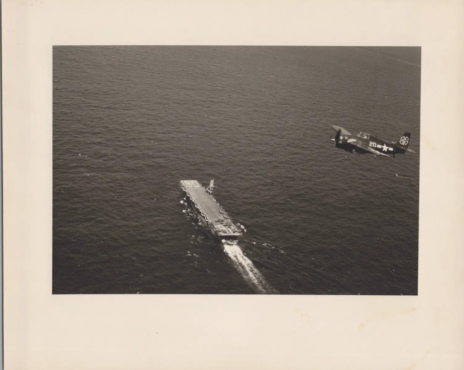 Carrier-Based Fighter Aircraft in Flight Near Escort Carrier CVE-80 (USS Petrof Bay)
