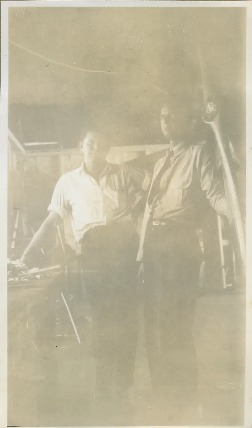 Two Men in a Hangar Beside an Aircraft Propeller, c. 1930s (Faded Print)