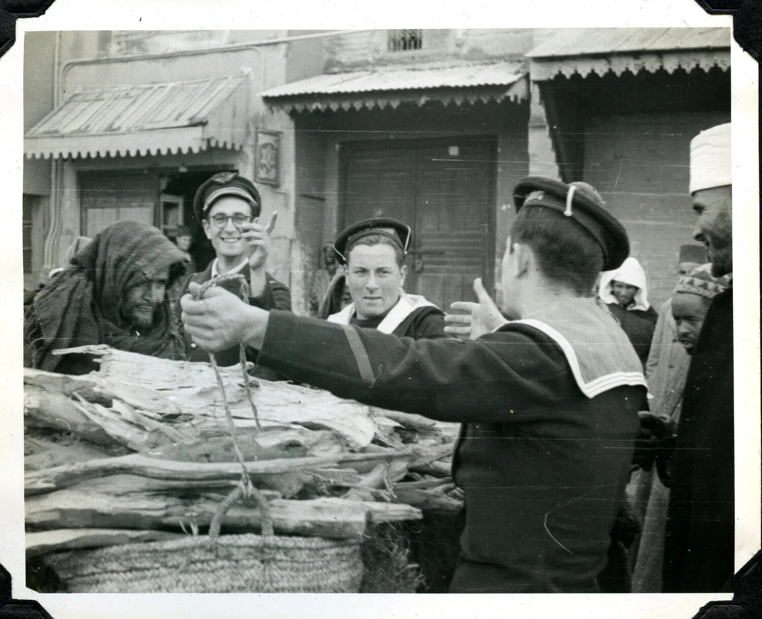 Allied Sailors Trading with Local Vendors at a North African Market, WWII